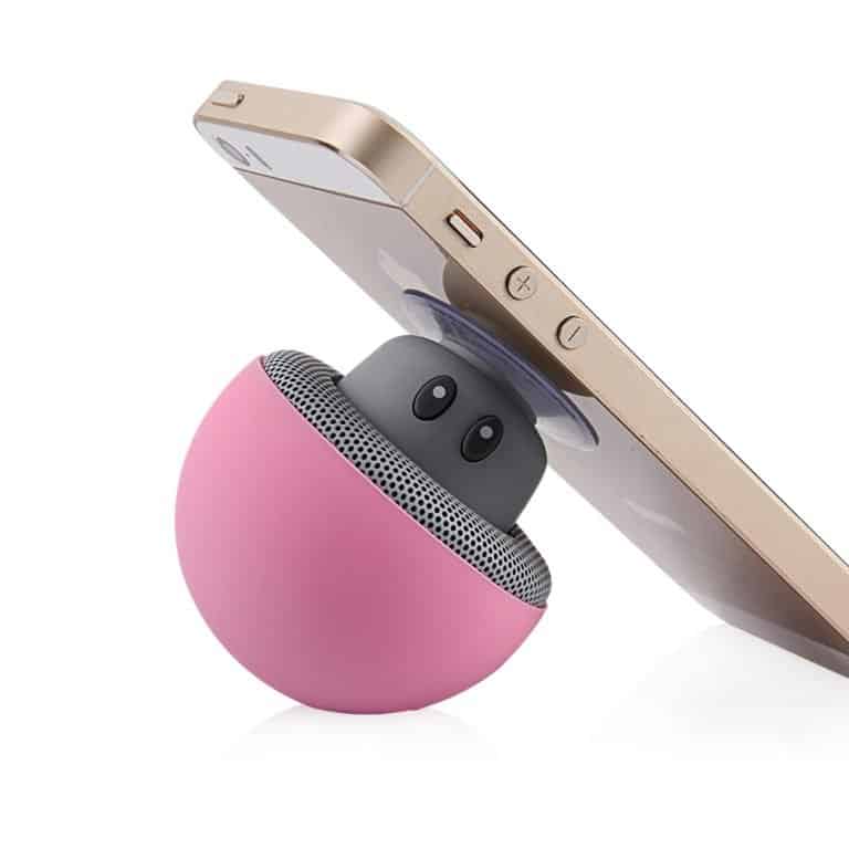A cute portable speaker attached to a smartphone