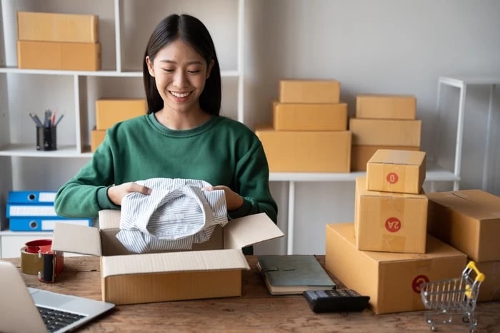 Picture of a woman unpacking products